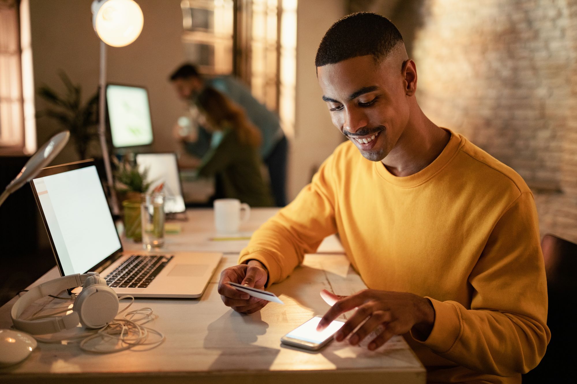 Happy entrepreneur withdrawing his online earnings