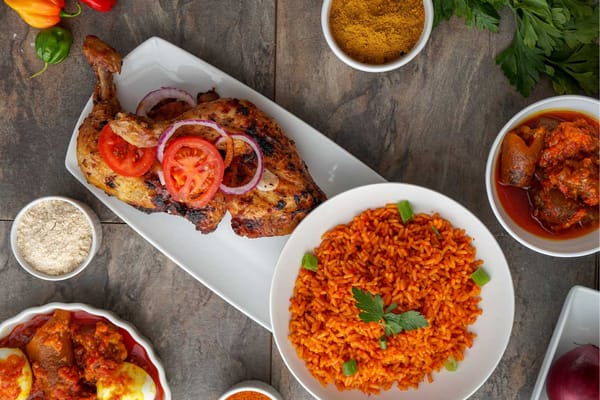 Nigerian Jollof rice, Barbecued Chicken and Assorted meat. Image source - Shutterstock